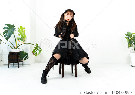 Woman in Gothic Lolita attire Woman in Gothic Lolita attire 140484999
