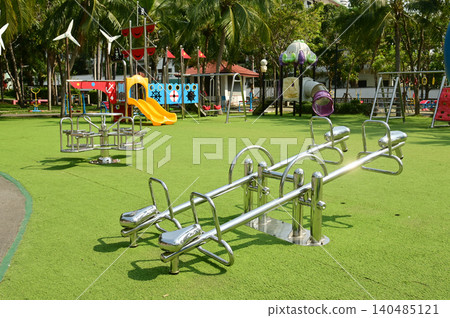A type of ride that involves sitting and rocking back and forth in a park. A type of ride that involves sitting and rocking back and forth in a park. 140485121
