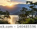 Sunset between the sea and the mountains 140485596