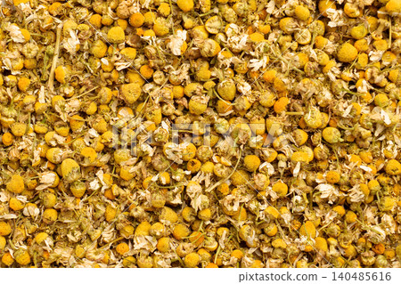 Yellow dandelion heads. Petals and stems are scattered loosely. Herbal background Yellow dandelion heads. Petals and stems are scattered loosely. Herbal background 140485616
