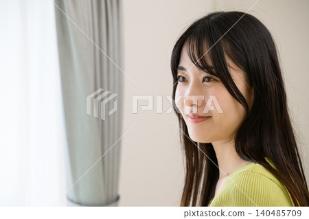 A Japanese woman gazing out the window A Japanese woman gazing out the window 140485709