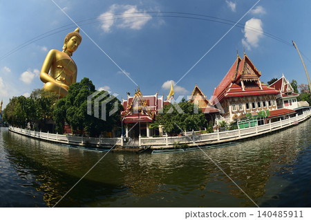 The Phra Phutthathamakaya Thepmongkol at Wat Pak Nam is a Buddha statue in the meditation posture and standing 69 meters tall. It is the tallest Buddha statue in Bangkok in Thailand. The Phra Phutthathamakaya Thepmongkol at Wat Pak Nam is a Buddha statue in the meditation posture and standing 69 meters tall. It is the tallest Buddha statue in Bangkok in Thailand. 140485911