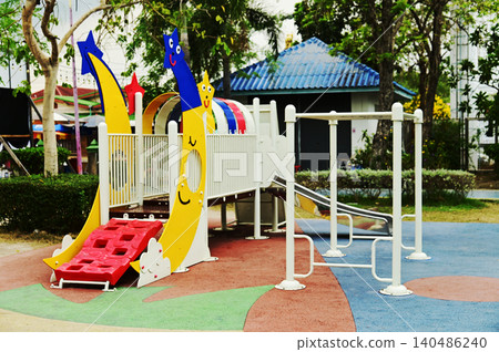 Climbing structures and slides are playground equipment for children, which are part of the public park. Climbing structures and slides are playground equipment for children, which are part of the public park. 140486240