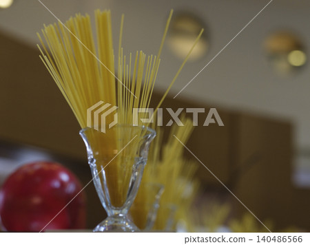 uncooked decorative spaghetti pastas in the kitchen 140486566