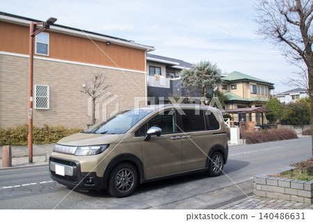 A compact minivan is driving on the road A compact minivan is driving on the road 140486631