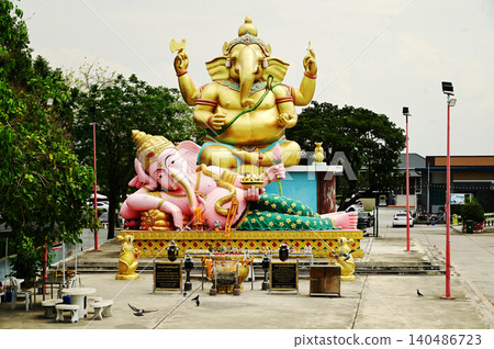 Outdoor large Statues of Lord Ganesha in seated and reclining poses in Bang Sai Public Park. Outdoor large Statues of Lord Ganesha in seated and reclining poses in Bang Sai Public Park. 140486723