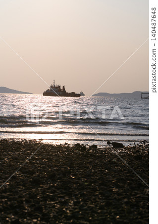 Sunset glows over calm waters 140487648