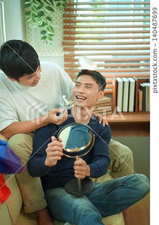 LGBTQ partners sharing beauty routine together LGBTQ partners sharing beauty routine together 140487699