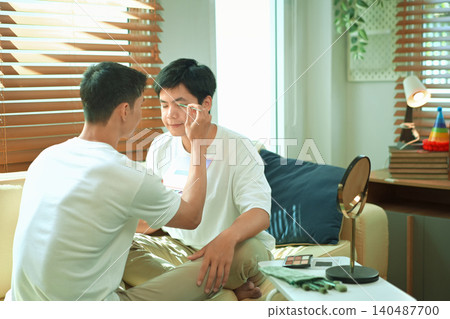 Photo set of LGBTQ applying glitter makeup with partner Photo set of LGBTQ applying glitter makeup with partner 140487700