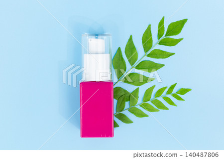 Pink pump bottle rests beside green leaves. Clean design hints at natural skincare. Bright background draws focus to product. Minimalist style suits modern beauty campaigns Pink pump bottle rests beside green leaves. Clean design hints at natural skincare. Bright background draws focus to product. Minimalist style suits modern beauty campaigns 140487806
