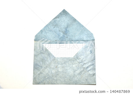 Textured paper envelope, made in vintage style with a sheet of paper from a notebook inside. 140487869