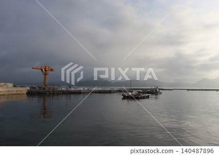 Harbor Scene with Crane and Misty Mountains Harbor Scene with Crane and Misty Mountains 140487896