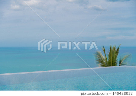 Clean Minimalist Ocean View from Luxury Poolside with Coconut Leaf Travel Background with Copy Space Clean Minimalist Ocean View from Luxury Poolside with Coconut Leaf Travel Background with Copy Space 140488032