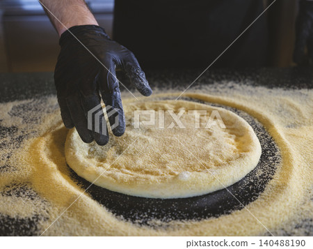 a fresh pizza dough in the kitchen a fresh pizza dough in the kitchen 140488190
