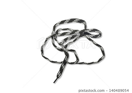 The white and black sneaker laces are flat. The white and black sneaker laces are flat. 140489054
