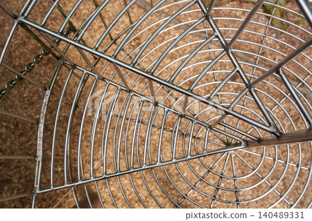 Point of view inside metal mesh tunnel at adventure park Point of view inside metal mesh tunnel at adventure park 140489331