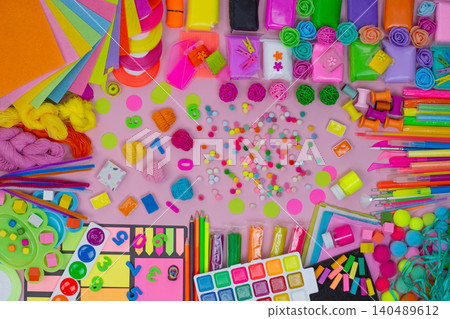 Stationery and materials for creativity top view. Colorful art crafts for drawing around. View from above. Stationery and materials for creativity top view. Colorful art crafts for drawing around. View from above. 140489612