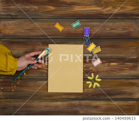 Table of an artist and empty copy space. View from above. creative colorful golden art supplies. Goods for creativity. Table of an artist and empty copy space. View from above. creative colorful golden art supplies. Goods for creativity. 140489615