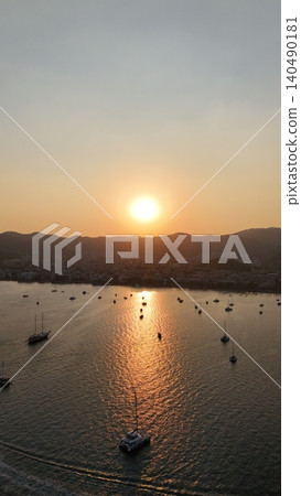 Sunset coastal city. Boats coastal town. Coastal mountain landscape, sea resort yachts, golden hour Sunset coastal city. Boats coastal town. Coastal mountain landscape, sea resort yachts, golden hour 140490181