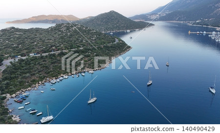 Coastal mountain landscape, sea resort yachts, golden hour Coastal mountain landscape, sea resort yachts, golden hour 140490429