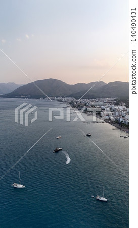 Boats coastal town. Boat turquoise ocean. High quality photo Boats coastal town. Boat turquoise ocean. High quality photo 140490431