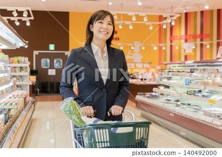 A businesswoman enjoying shopping at the supermarket. A businesswoman enjoying shopping at the supermarket. 140492000