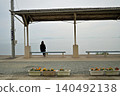 A woman gazing at the sea at Shimonada Station 140492138