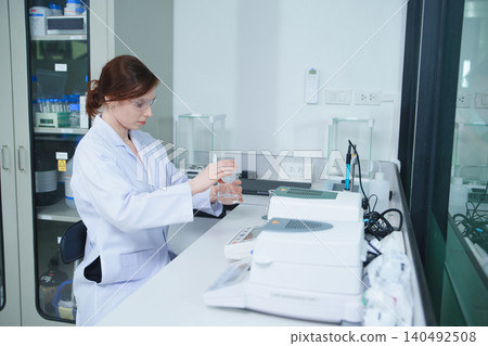 Scientist Conducting Experiment in Research Laboratory 140492508