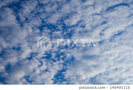 Beautiful blue sky filled with textured white clouds. Natural cloudscape background on bright sunny day. Perfect template for your projects. Beautiful blue sky filled with textured white clouds. Natural cloudscape background on bright sunny day. Perfect template for your projects. 140493118