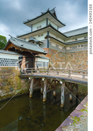Kanazawa, Japan - Oct 6 2024, vertical view of facade of Kanazawa Castle with the moat in the foreground, on a cloudy day, without people, at daytime, Kanazawa, Japan Kanazawa, Japan - Oct 6 2024, vertical view of facade of Kanazawa Castle with the moat in the foreground, on a cloudy day, without people, at daytime, Kanazawa, Japan 140493168