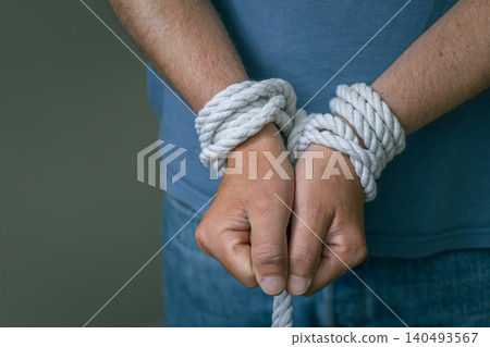 Bound Hands With Rope Captivity Concept Bound Hands With Rope Captivity Concept 140493567