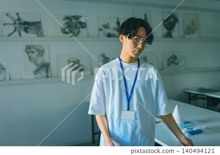 An instructor standing in a classroom at an art preparatory school An instructor standing in a classroom at an art preparatory school 140494121