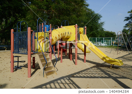 Climbing structures and slides are playground equipment for children, which are part of the Lumpini public park in Bangkok capital city , Thailand. Climbing structures and slides are playground equipment for children, which are part of the Lumpini public park in Bangkok capital city , Thailand. 140494284