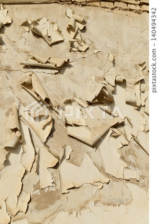 Texture or background of the Cracked and peeling paint on the wall. Close-up view. Grunge old texture. Abstract background. Vintage style. Scratched and chipped surface. Texture or background of the Cracked and peeling paint on the wall. Close-up view. Grunge old texture. Abstract background. Vintage style. Scratched and chipped surface. 140494342
