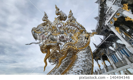 Ornate Naga Serpent Sculpture at Thai Temple with Silver Mosaic Ornate Naga Serpent Sculpture at Thai Temple with Silver Mosaic 140494346