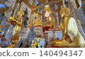 Golden Buddha Statues in Ornate Mirrored Temple Interior Thailand 140494347