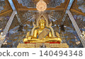 Golden Buddha Statue in Radiant Mirror Mosaic Temple in Thailand 140494348