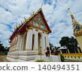 Traditional Thai Buddhist Temple with Golden Ornaments and Blue Sky 140494351
