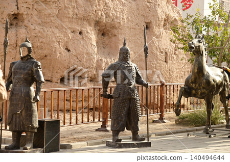 The ancient metal soldier statues in the ancient city of Kuche on the Silk Road and the enchanting city of Aksu. Kuche, a colorful ancient kingdom. The ancient metal soldier statues in the ancient city of Kuche on the Silk Road and the enchanting city of Aksu. Kuche, a colorful ancient kingdom. 140494644