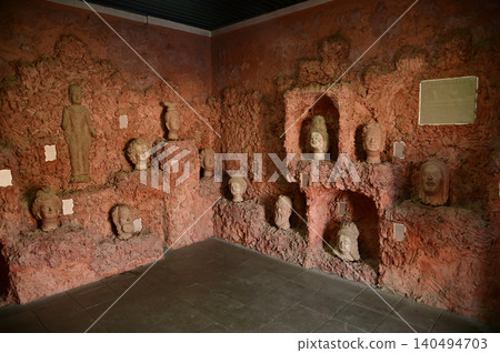 The statues of Buddha's heads and important figures inside the exhibition hall of the Kuche Palace are renowned as the residence of the last patriotic prince. The statues of Buddha's heads and important figures inside the exhibition hall of the Kuche Palace are renowned as the residence of the last patriotic prince. 140494703