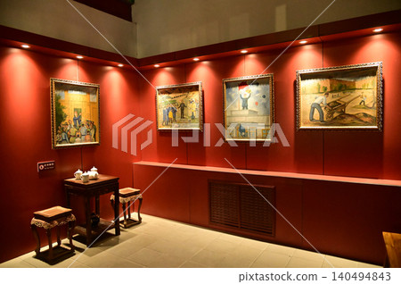The framed paintings inside the exhibition hall of the Kuche Palace are renowned as the residence of the last patriotic prince, who played a key role in the liberation of Xinjiang.China. 140494843