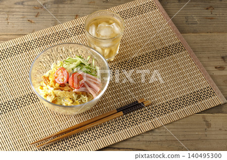 Cold ramen and tea served in a clear glass bowl. Cold ramen and tea served in a clear glass bowl. 140495300