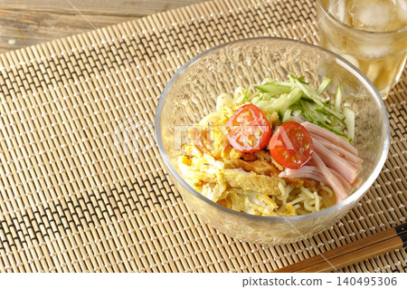 Cold ramen and tea served in a clear glass bowl. Cold ramen and tea served in a clear glass bowl. 140495306