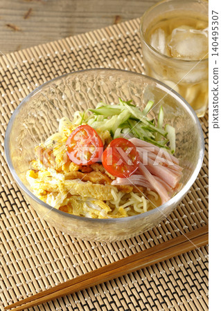 Cold ramen and tea served in a clear glass bowl. 140495307