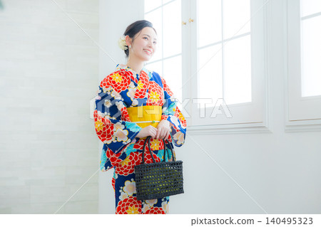 A woman in a yukata A woman in a yukata 140495323