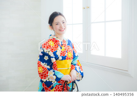 A woman in a yukata A woman in a yukata 140495356