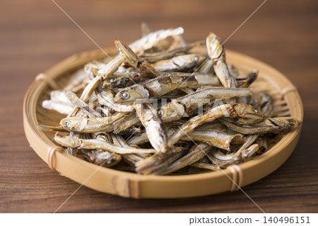 Dried sardines served in a basket 140496151