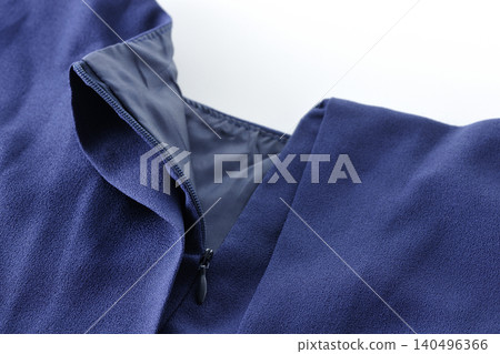 Unzipping a garment Unzipping a garment 140496366