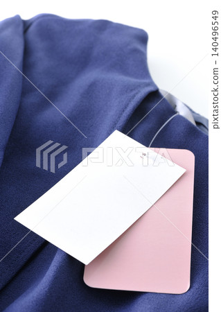 Clothes with price tags still attached Clothes with price tags still attached 140496549