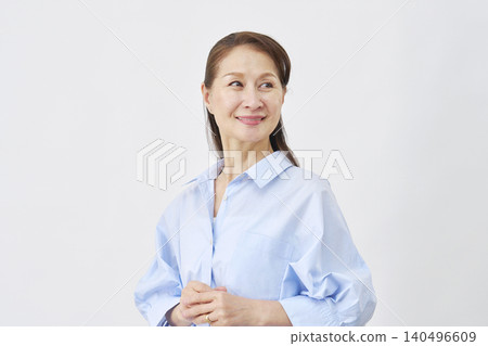 Smiling woman on white background Smiling woman on white background 140496609